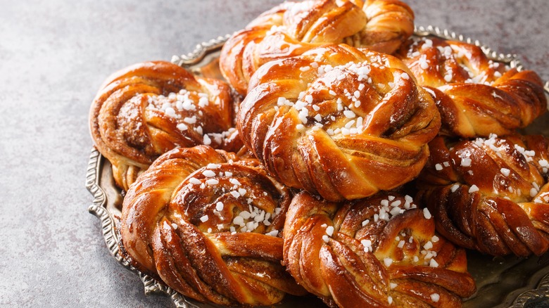 Swedish cardamom buns with pearl sugar on tray