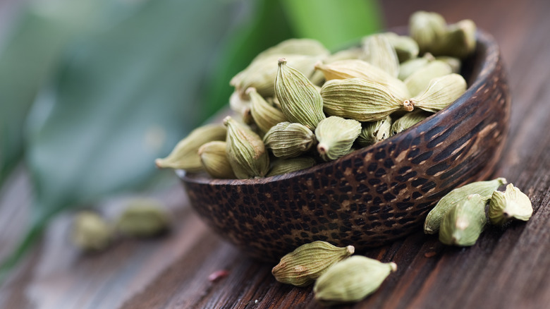 Bowl of green cardamom pods