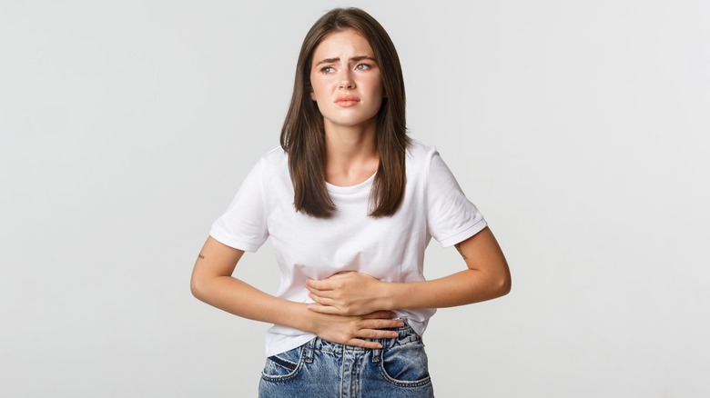 Woman having a stomach cramp
