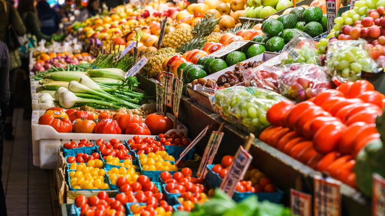 Vendor stand with various vegetables and fruits