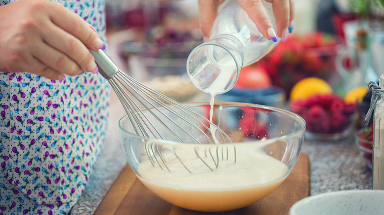 person mixing pancake batter