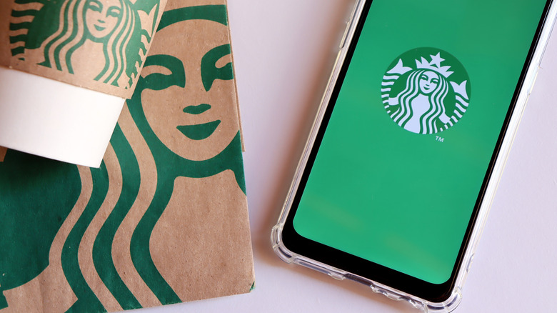 Starbucks logo on a bag and a phone