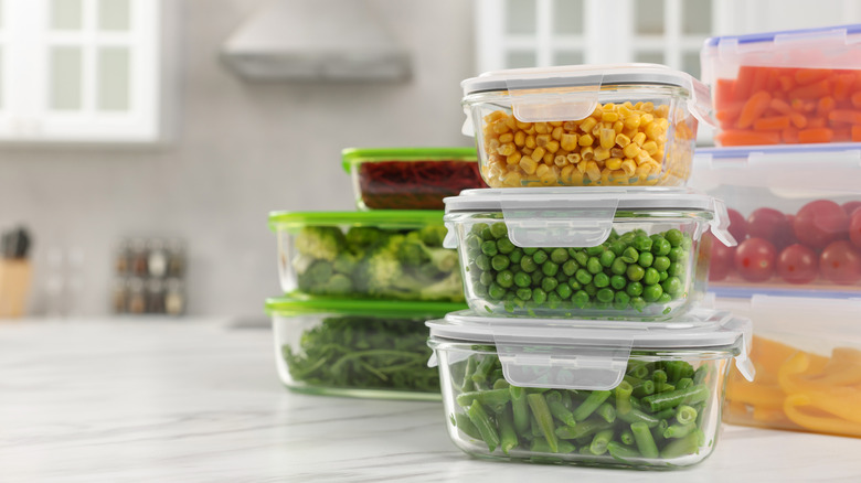 a stack of filled food storage containers