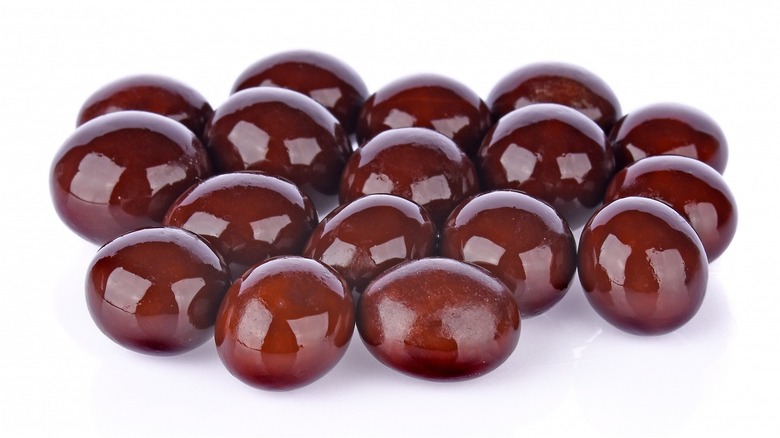 Chocolate covered espresso beans on white background