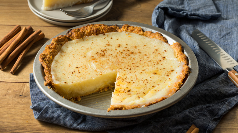 sugar cream pie with graham cracker crust in a rustic setting