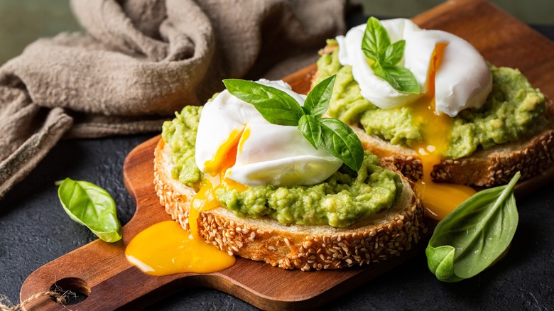 poached eggs on top of avocado toast