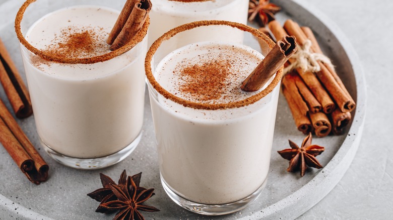 Eggnog holiday drink cinnamon aniseed background