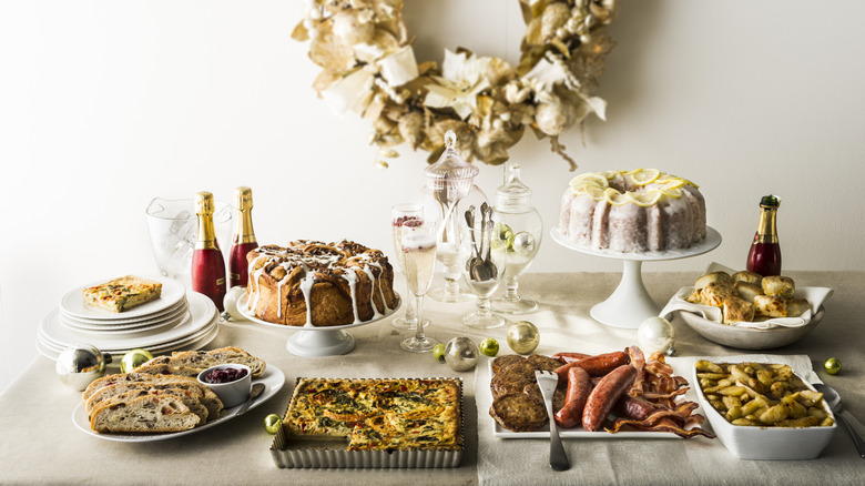 Christmas brunch buffet laid out on a festive table with Champagne