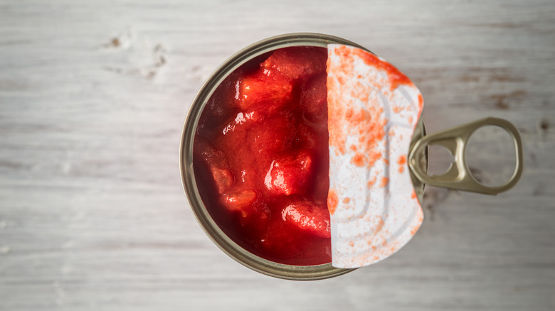 Partially opened can of tomatoes