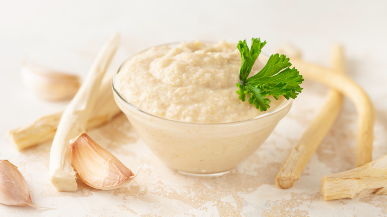 bowl filled with horseradish topped with parsley