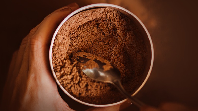 Hot cocoa powder in a jar with spoon