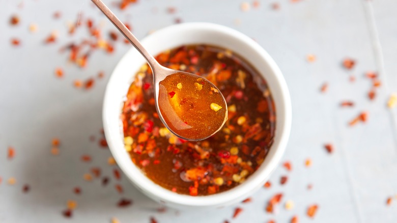 spoon of hot honey over dish