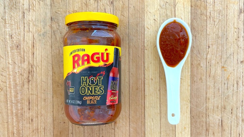 Jar and spoonful of RAGÚ x Hot Ones Limited Edition Chipotle Blaze sauce