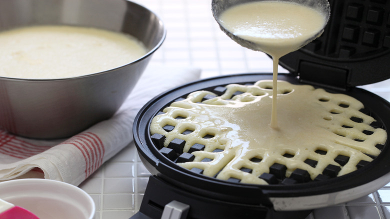 waffle batter poured into waffle iron