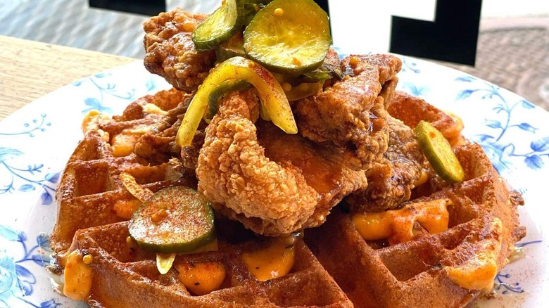 Chicken and waffles with hot honey and pickles