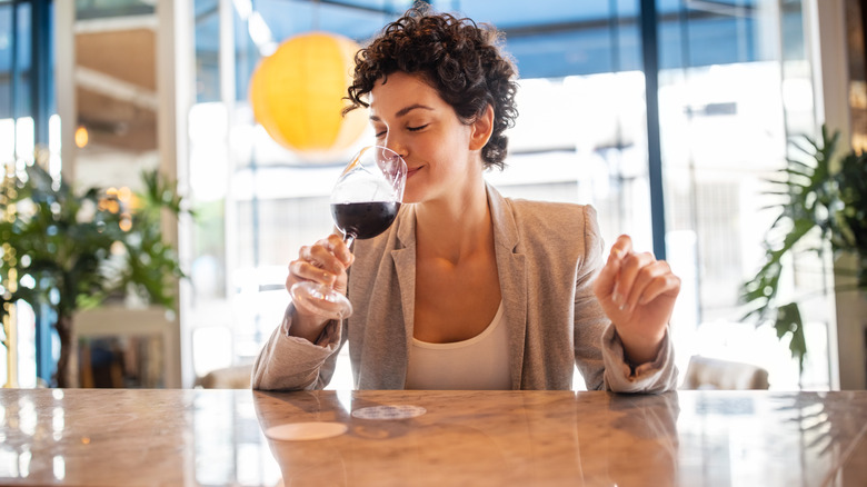 Person smelling wine