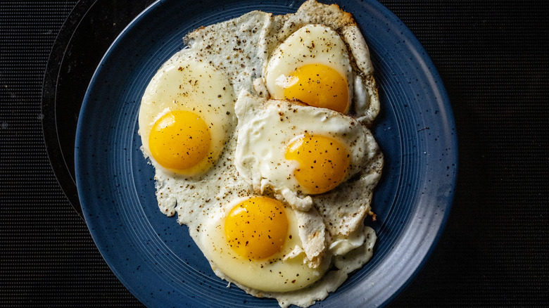 fried eggs on a plate without the plate