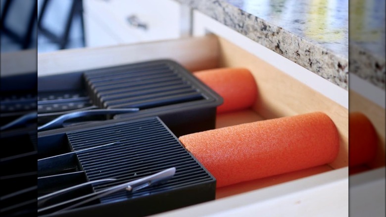 pool noodle kitchen drawer hack