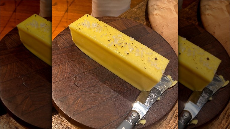 Stick of butter with slice