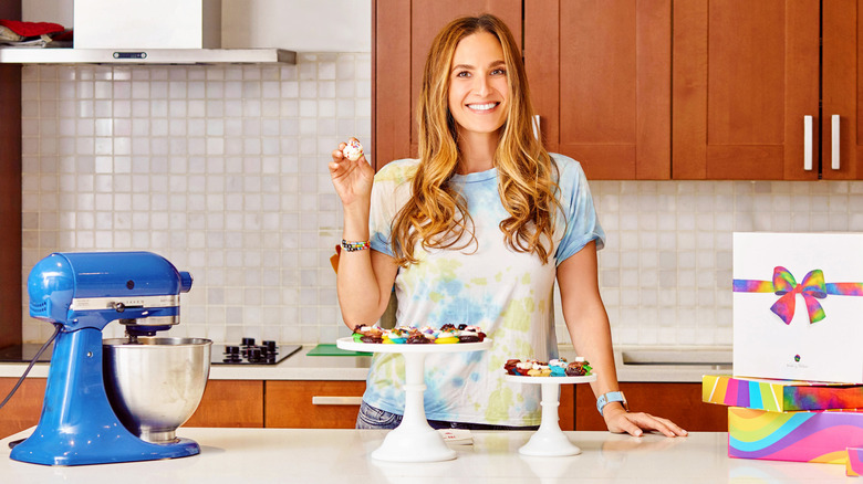 Melissa Ben-Ishay holding a mini-cupcake