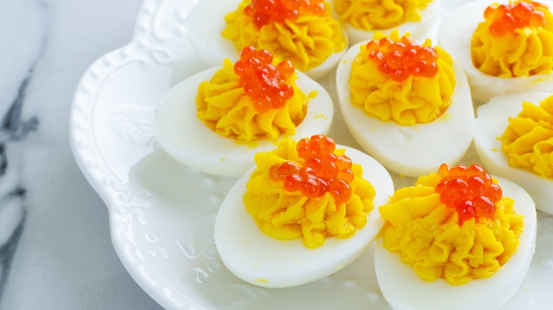 Russian deviled eggs with caviar