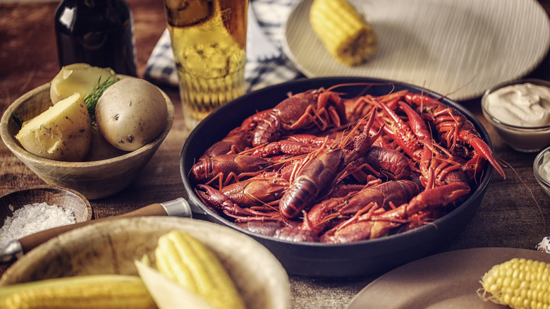 crawfish in a plate surrounded by vegetables