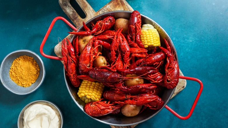 crawfish in a pot with corn and potatoes