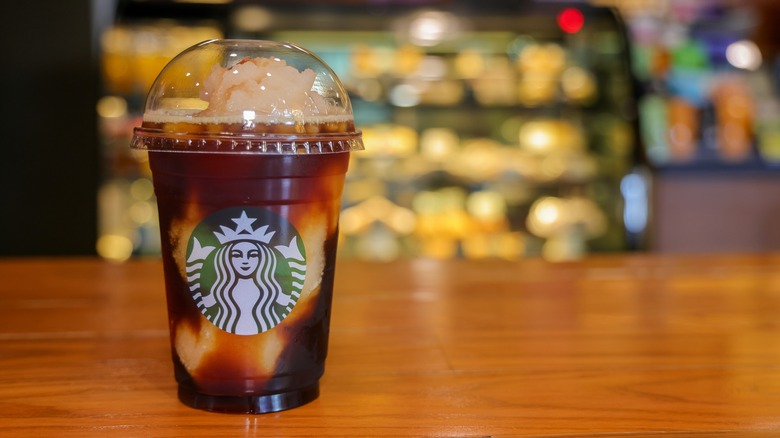 A Starbucks beverage topped with whipped cream