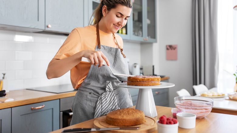 a woman making a sponge cake