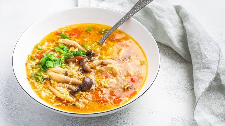 bowl of mushroom tomato egg drop soup