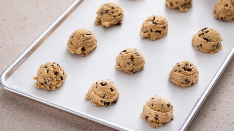 Unbaked Crumbl Cookies on tray