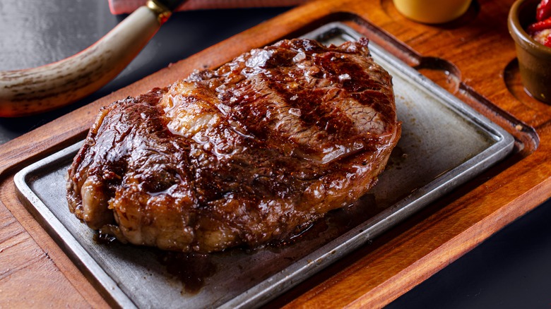 Cooked steak on cutting board