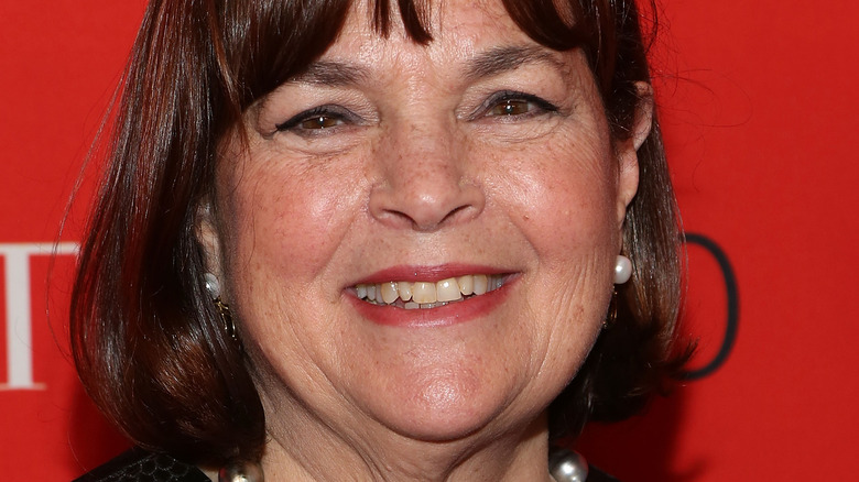 Ina Garten with wide smile and pearl earrings