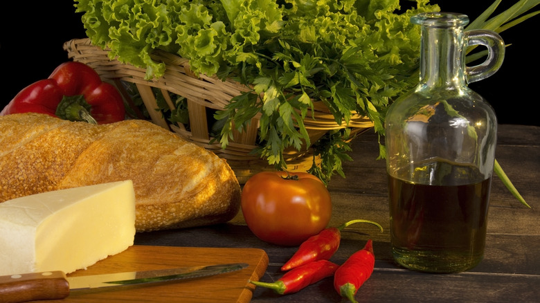 Board with bread, cheese and oil