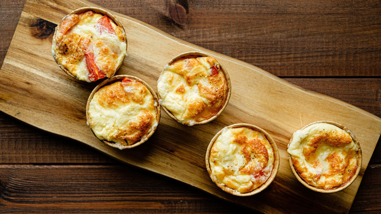 mini cheese souffles on a board