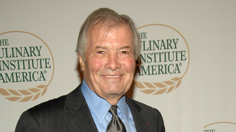 Jacques Pepin smiling at an event at the Culinary Institute of America