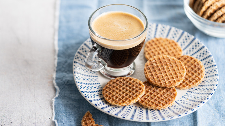 Dutch stroopwafels on a plate with a cup of espresso