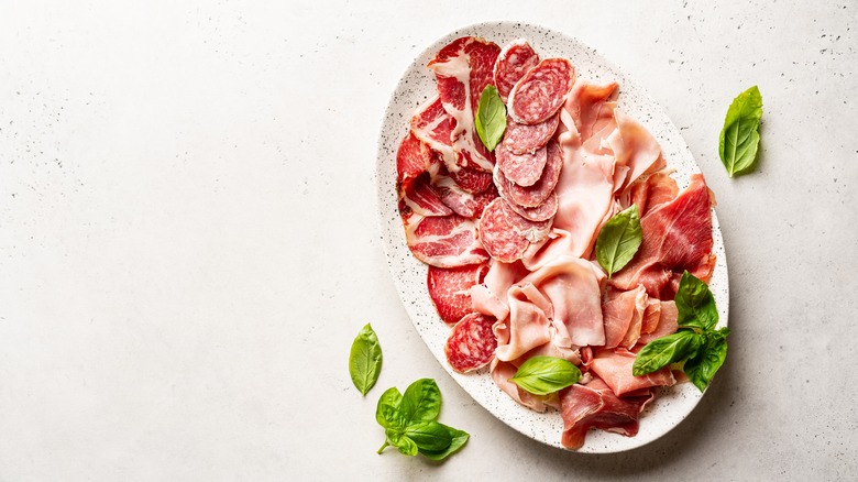 Charcuterie plate on white background