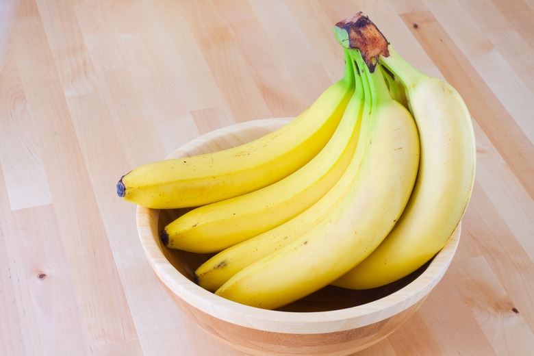 How do you stop bananas from ripening or getting bruised?