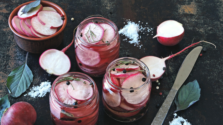 Pickled radishes in jars