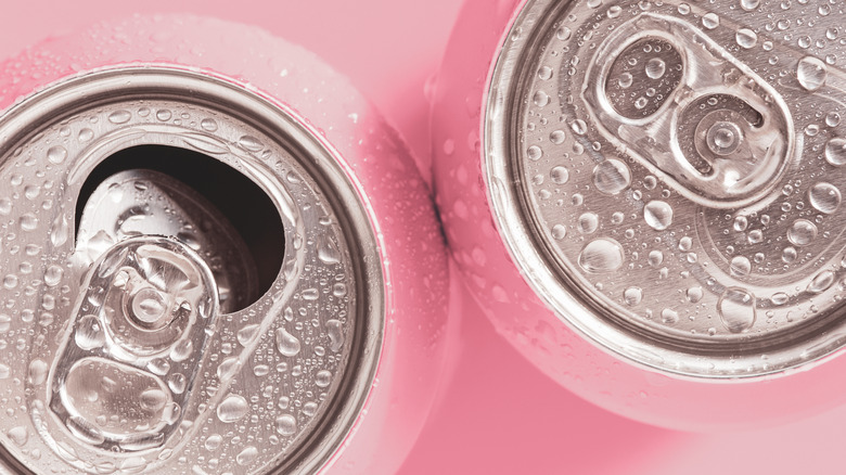 Pink cans with water droplets