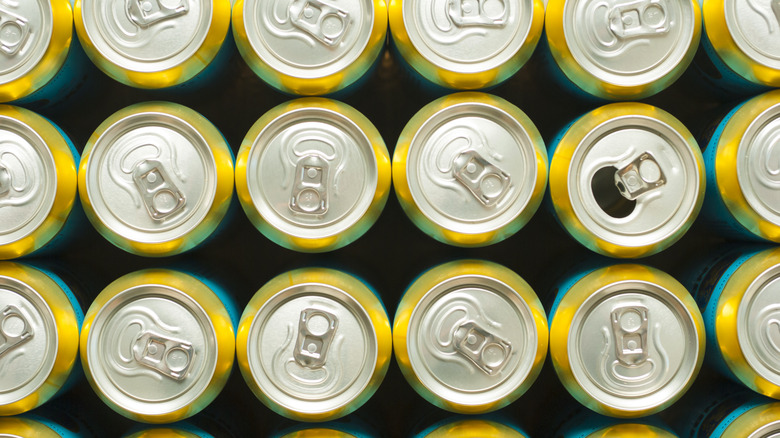 top view of Canned beverages with one can opened