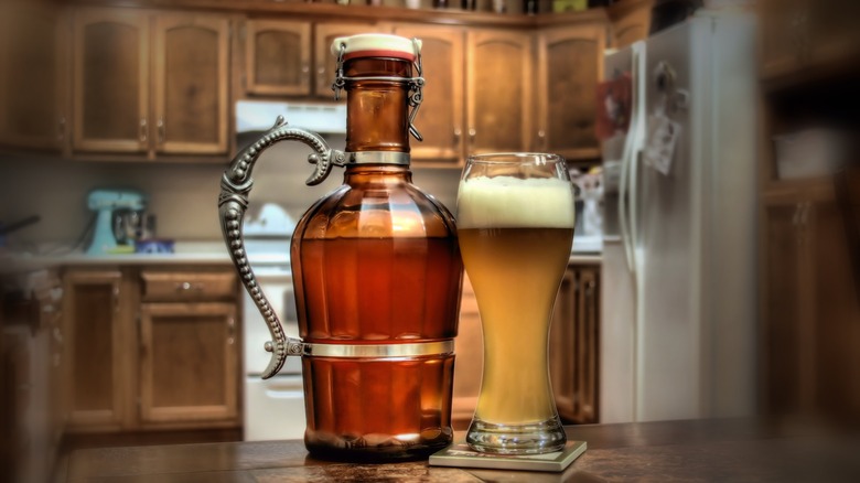 Growler with beer in kitchen