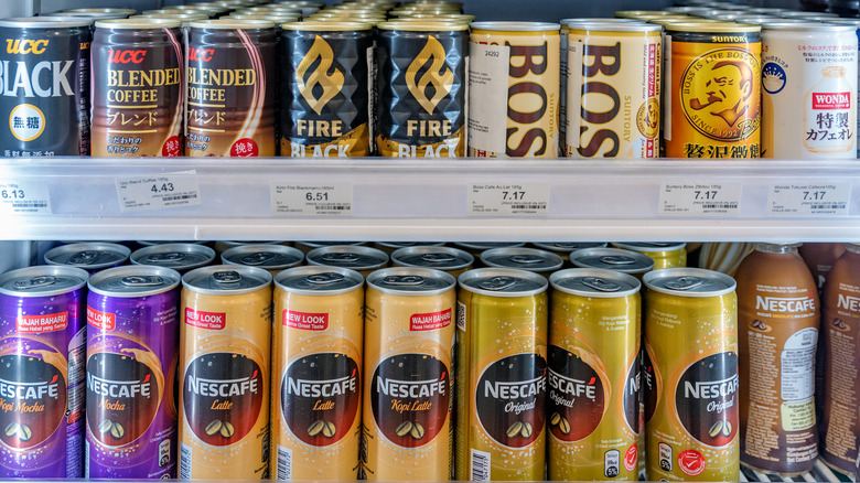 Cans of coffee on store shelf