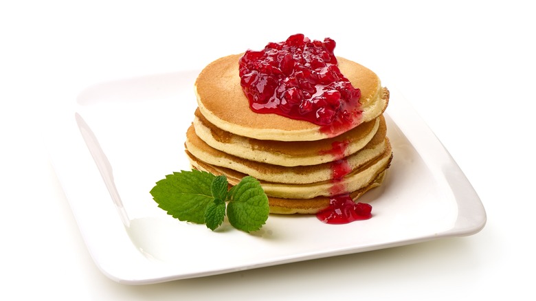 Pancakes topped with cranberry sauce