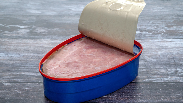 Canned ham with lid peeled back