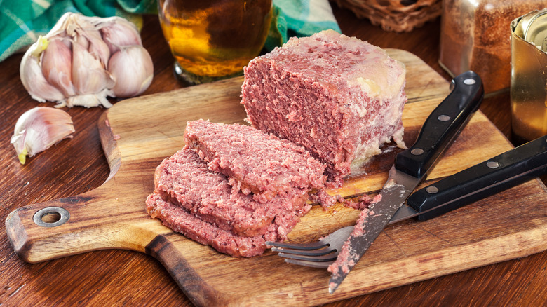 Canned corned beef on cutting board