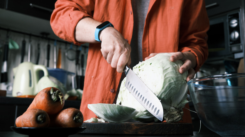 Man chopping cabbage to make coleslaw 