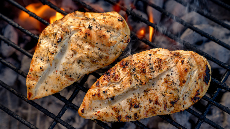 two chicken breast on grill