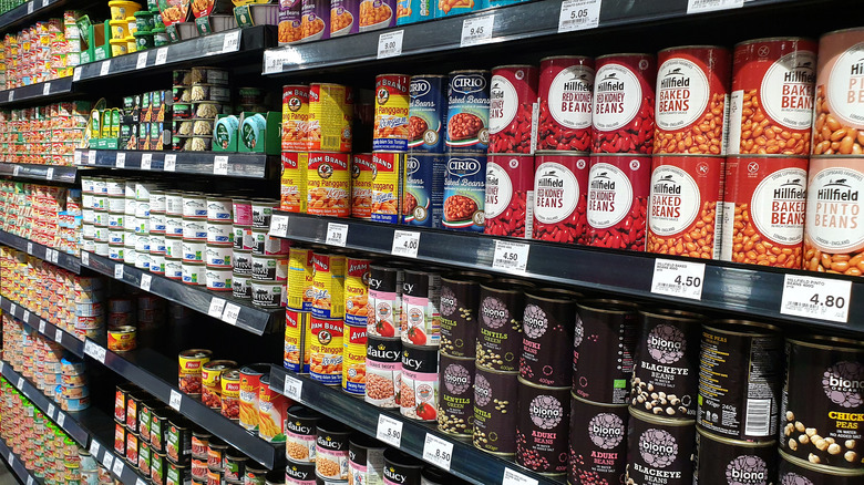 Different brands of canned beans in a store 